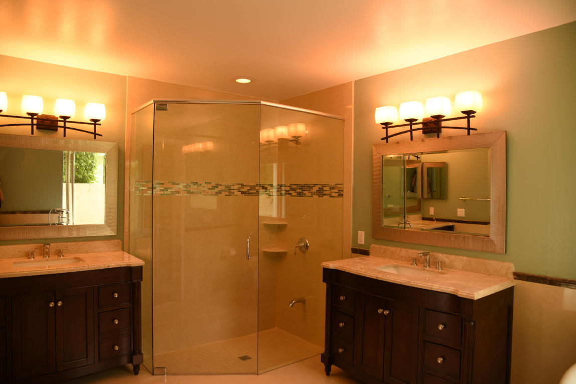 4465 Northwest 28th Way Boca Raton, FL 33434 - Photo 10 of 22 a bathroom with a shower sink and mirror