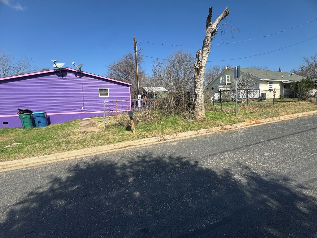 404 West Cleveland Street, Unit 1/2 Elgin, TX 78621 - Photo 9 of 23 View of asphalt street featuring curbs
