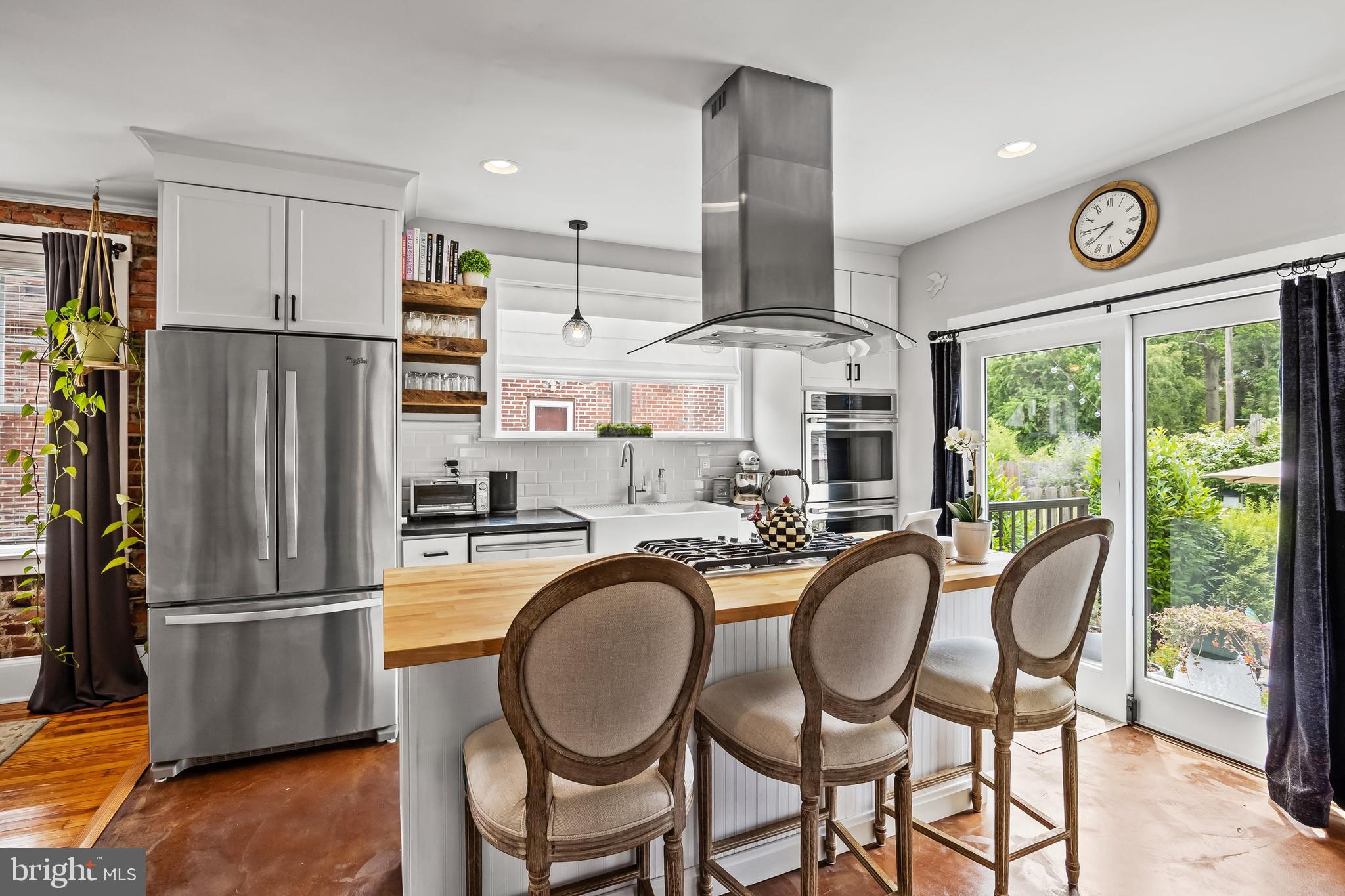 239 James Street Mount Ephraim, NJ 08059 - Photo 12 of 39 a kitchen with stainless steel appliances granite countertop a dining table chairs refrigerator and microwave