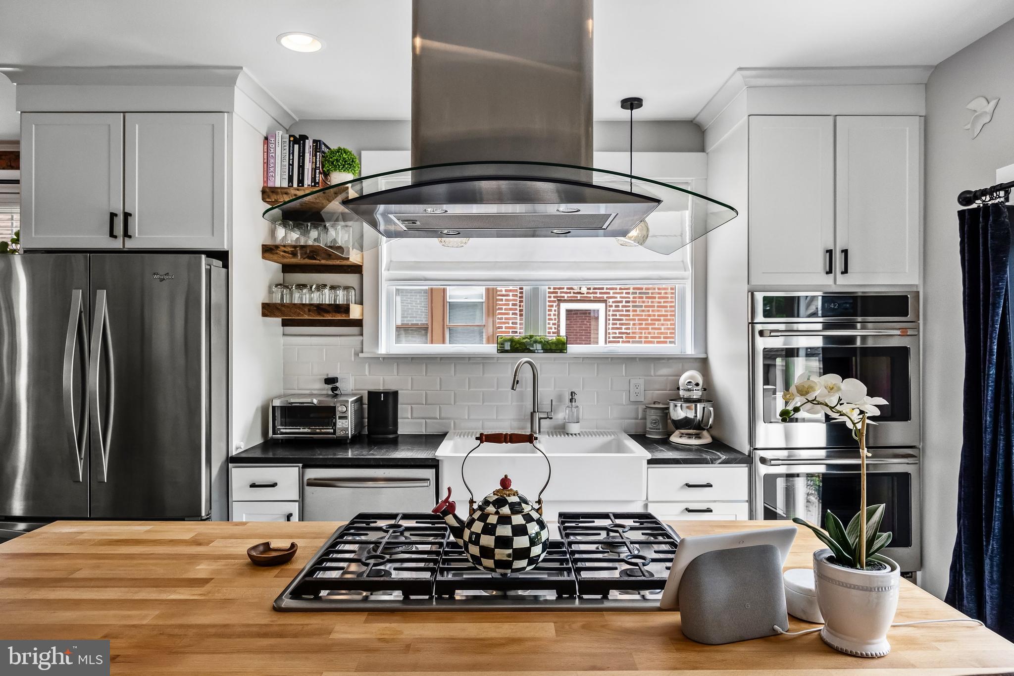 239 James Street Mount Ephraim, NJ 08059 - Photo 14 of 39 a kitchen with kitchen island granite countertop stainless steel appliances a sink a stove and cabinets