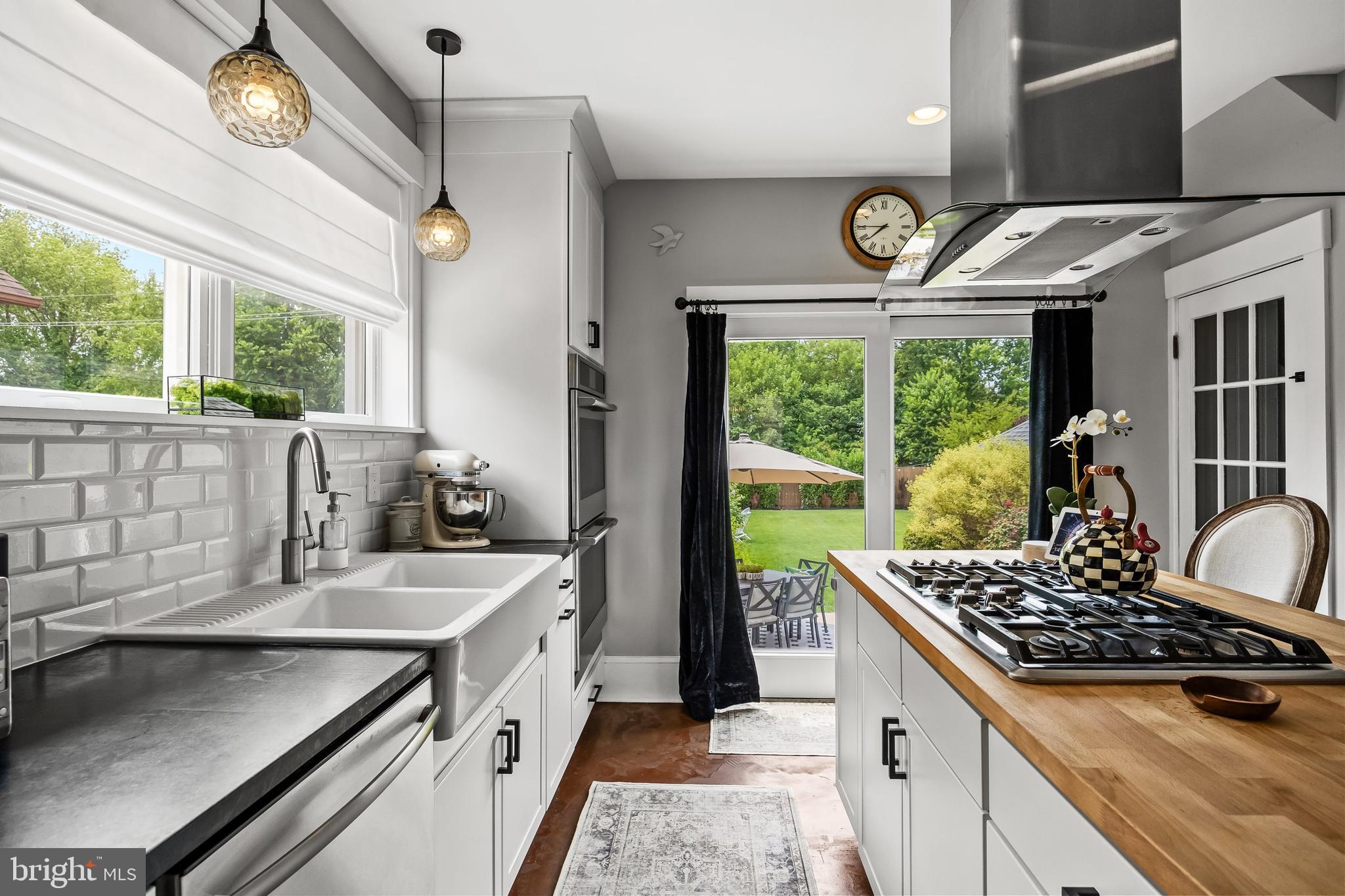 239 James Street Mount Ephraim, NJ 08059 - Photo 15 of 39 a kitchen that has a sink and a stove