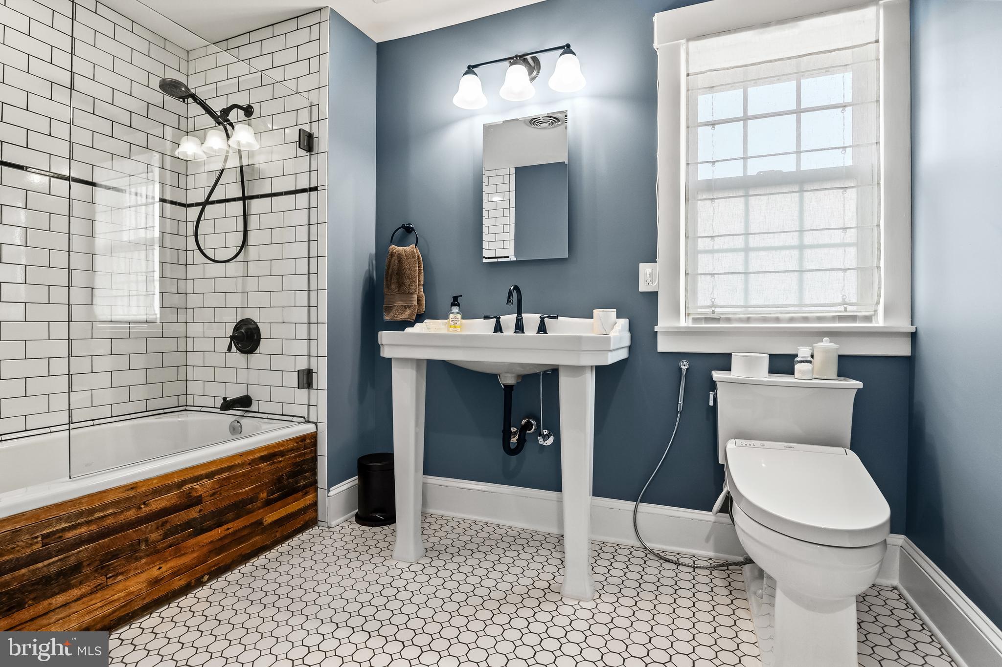 239 James Street Mount Ephraim, NJ 08059 - Photo 25 of 39 a bathroom with a sink a toilet and shower