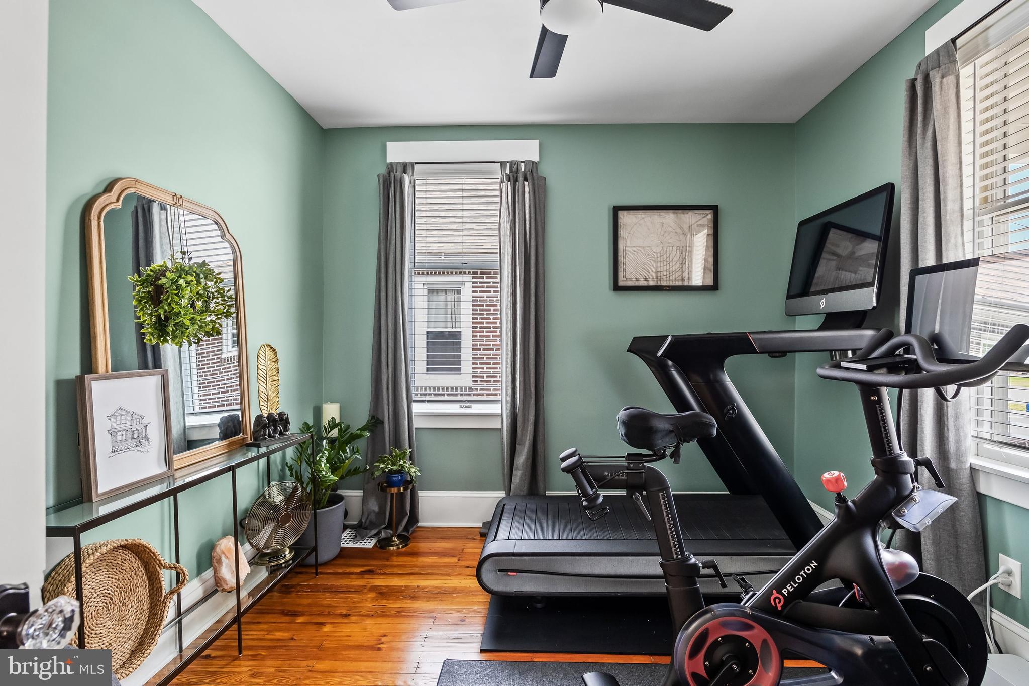 239 James Street Mount Ephraim, NJ 08059 - Photo 8 of 39 a room with gym equipment and windows