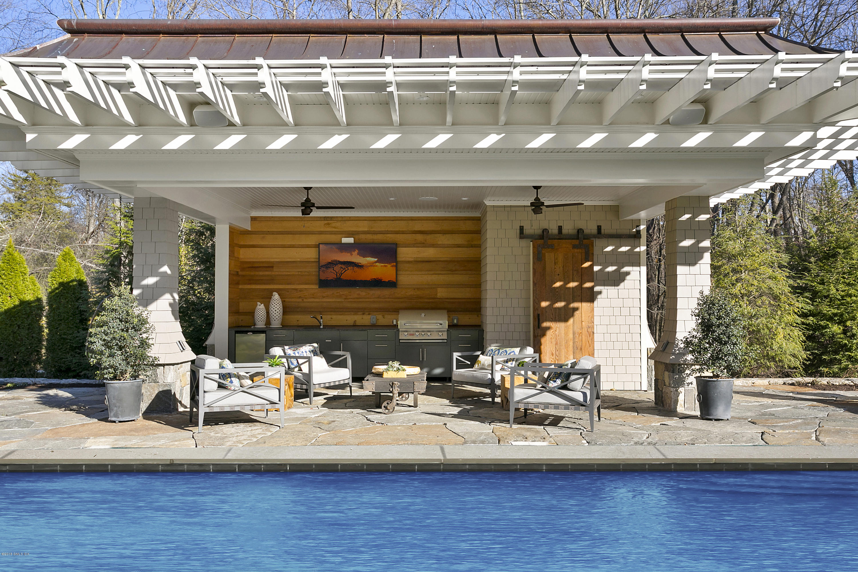 80 Howard Road Greenwich, CT 06831 - Photo 28 of 32 a view of swimming pool with outdoor seating
