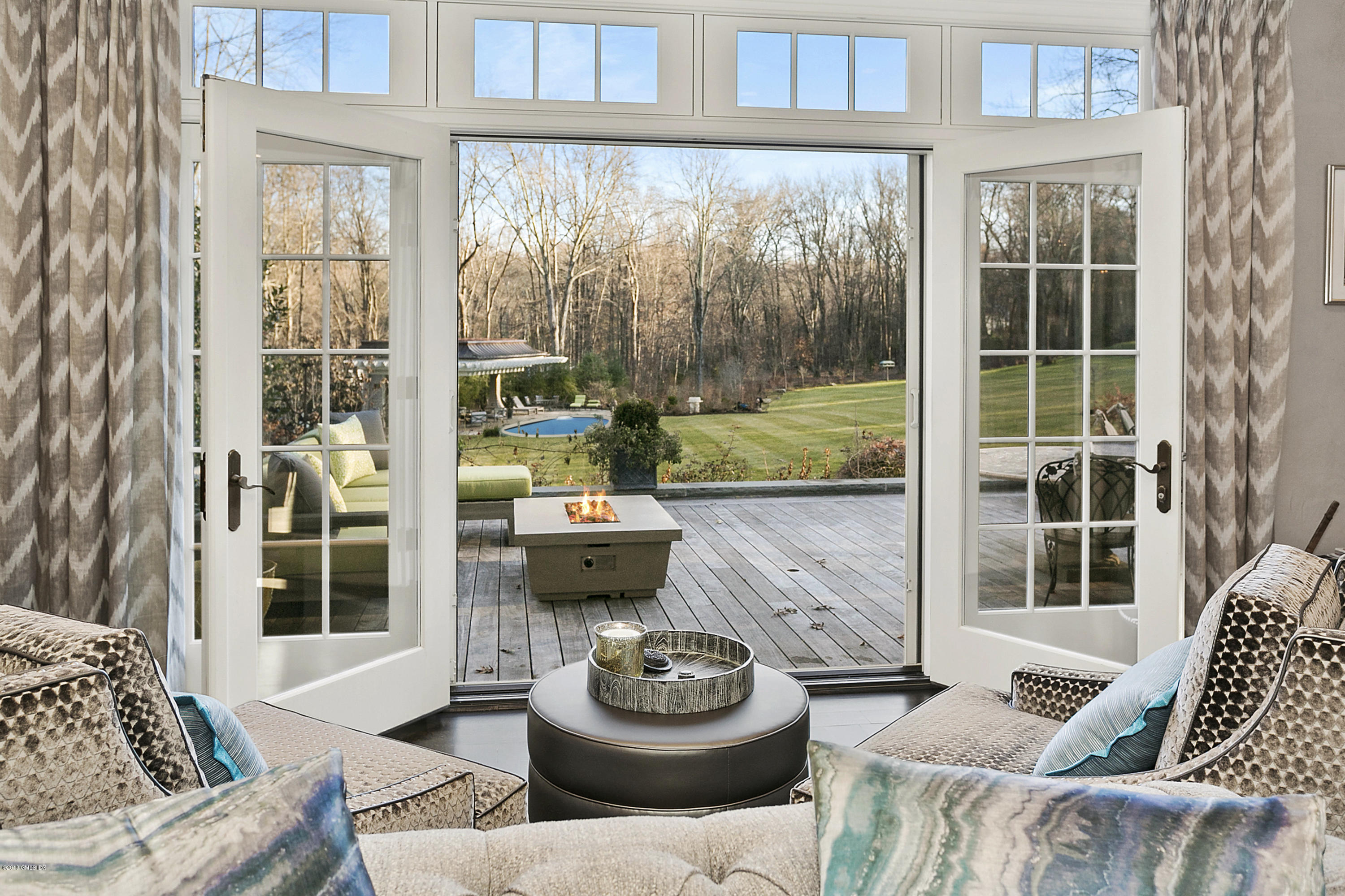 80 Howard Road Greenwich, CT 06831 - Photo 10 of 32 a living room with furniture and a large window
