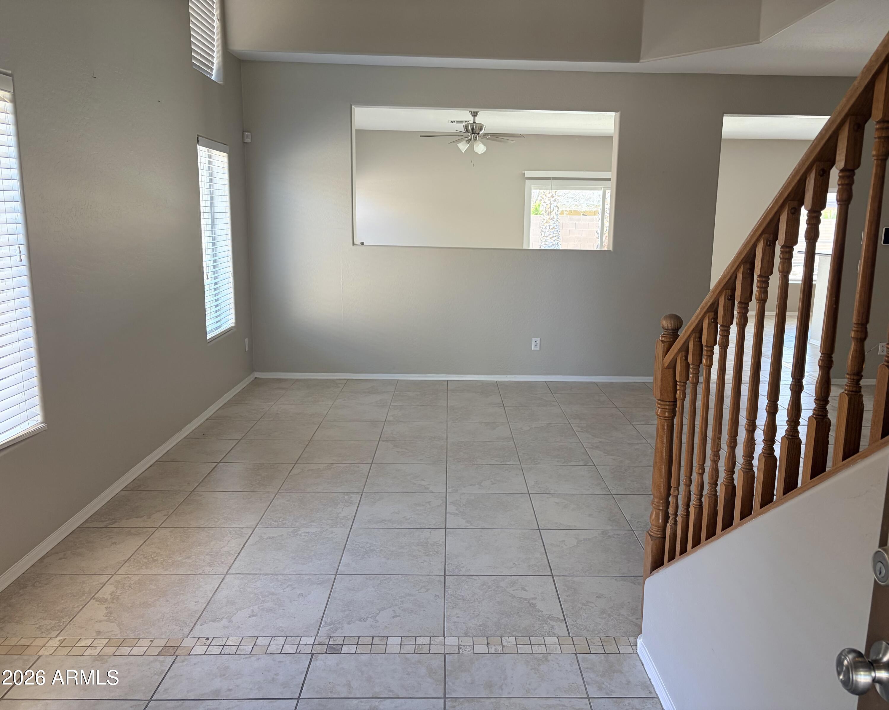 191 West Rio Drive Casa Grande, AZ 85122 - Photo 5 of 34 an empty room with staircase and windows