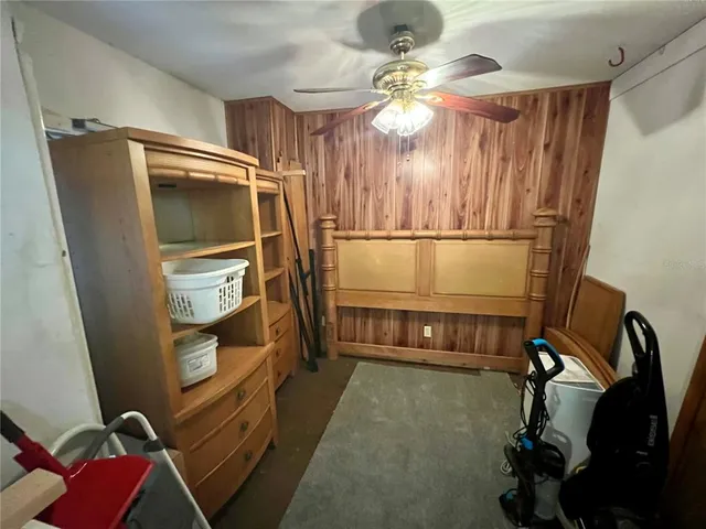 a yellow house with trees in front of it