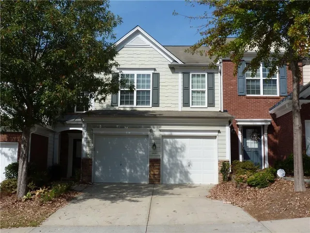 a front view of a house with yard