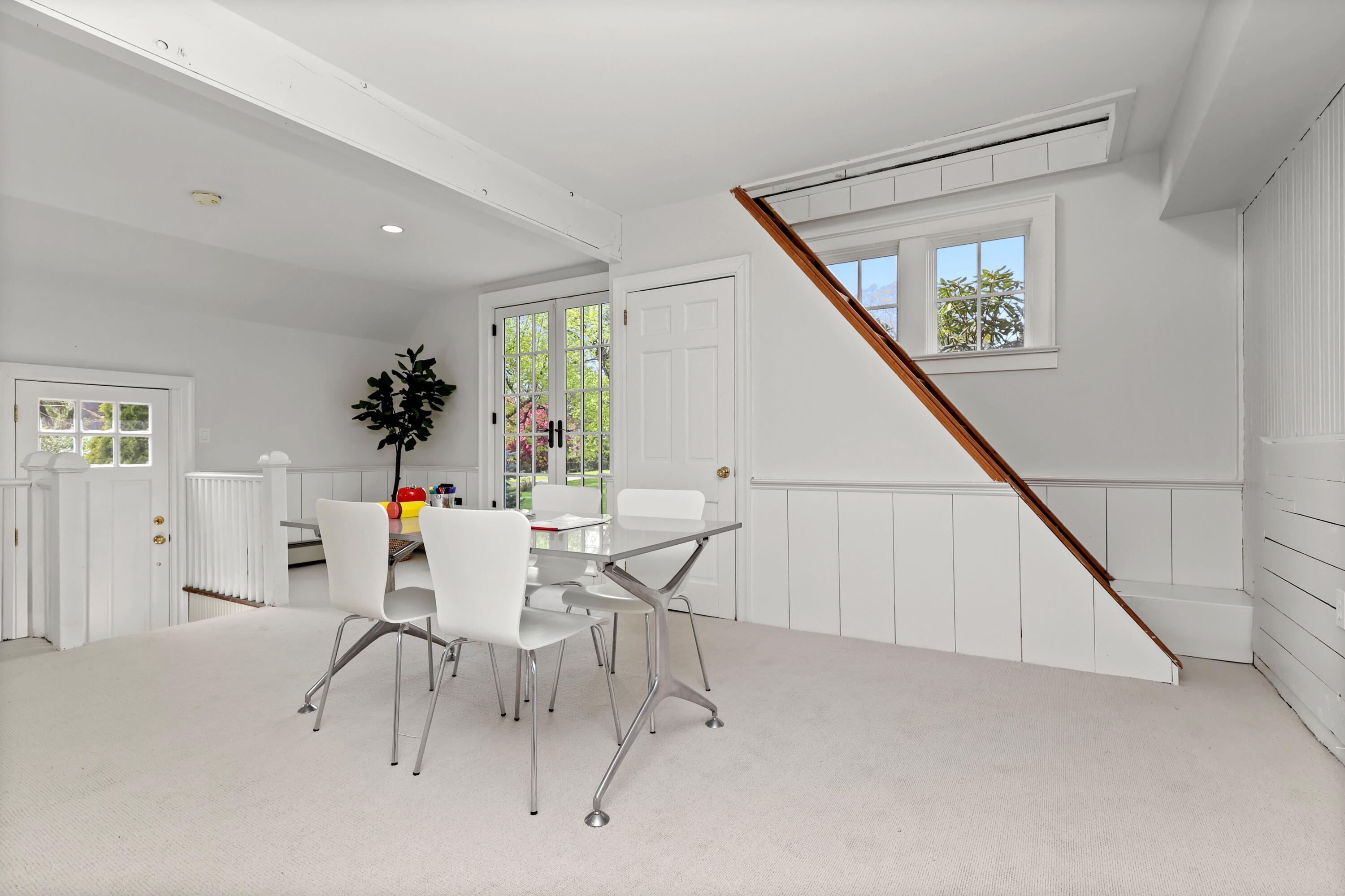 203 Brushy Ridge Road New Canaan, CT 06840 - Photo 20 of 42 a dining room with furniture and entryway