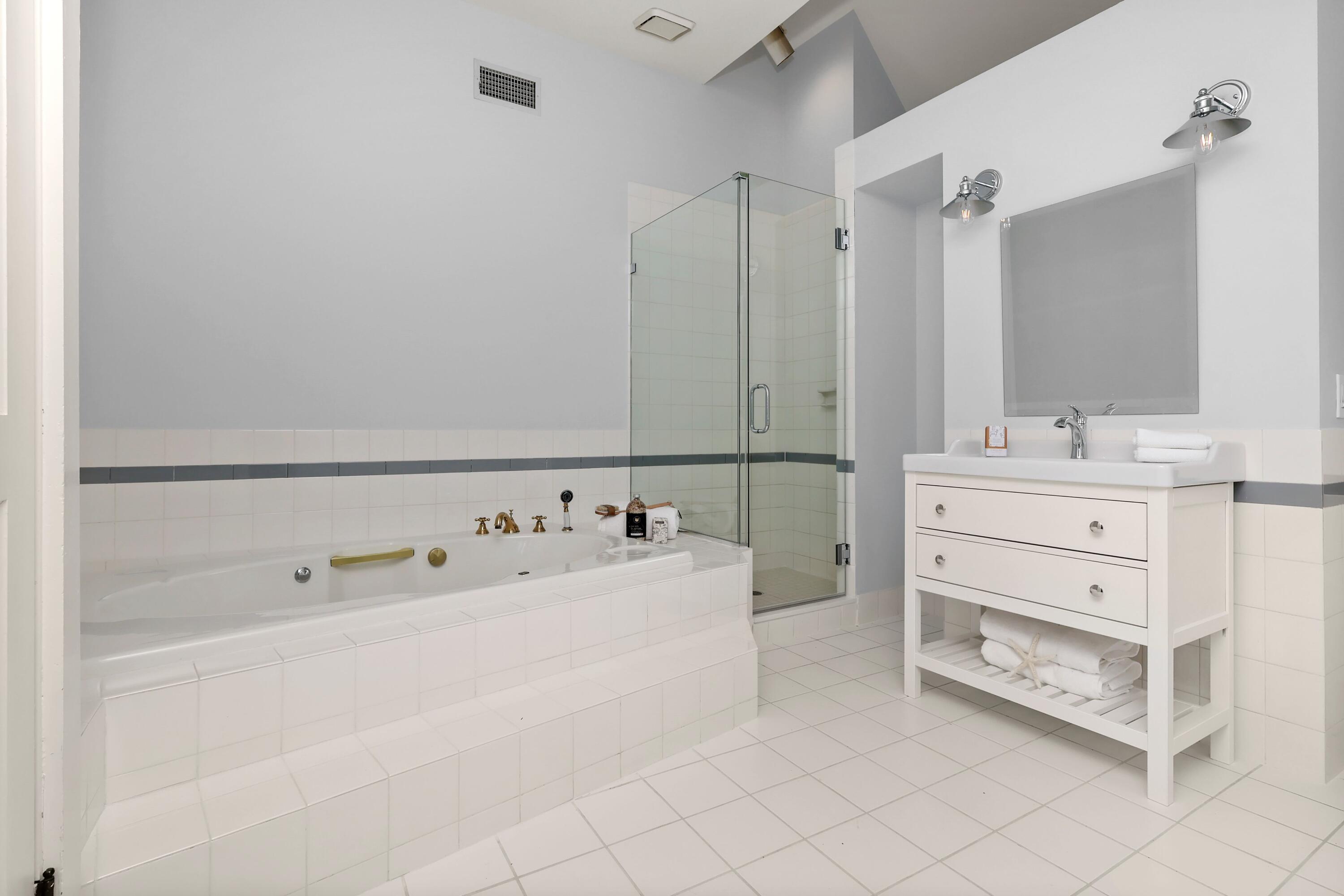 203 Brushy Ridge Road New Canaan, CT 06840 - Photo 27 of 42 a bathroom with a double vanity sink mirror and bathtub