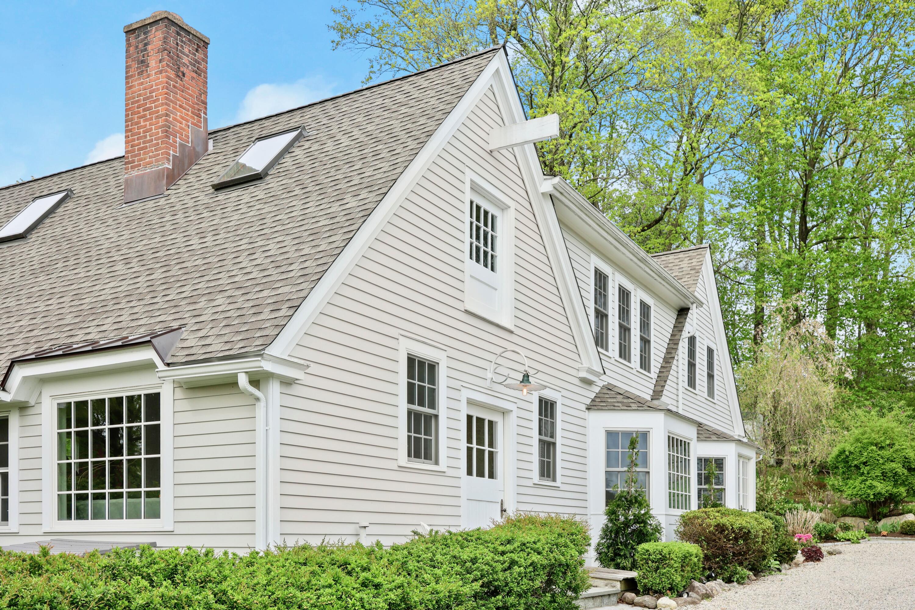 203 Brushy Ridge Road New Canaan, CT 06840 - Photo 3 of 42 a view of a house with a yard