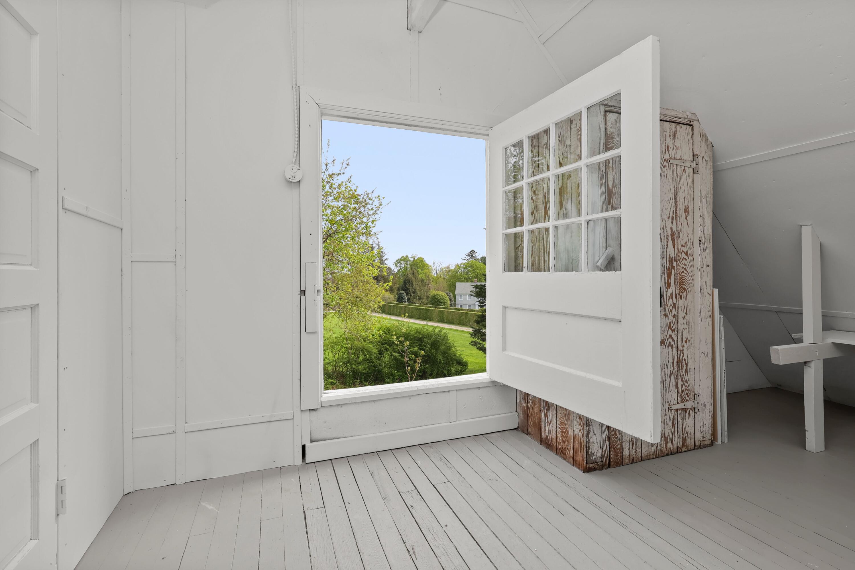 203 Brushy Ridge Road New Canaan, CT 06840 - Photo 36 of 42 a view of an entryway with wooden floor and door