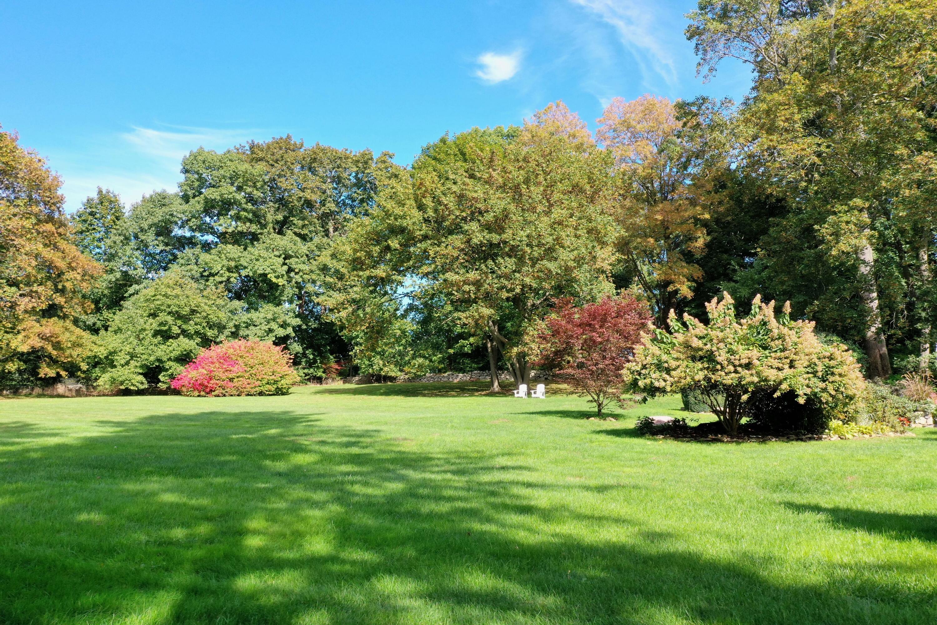 203 Brushy Ridge Road New Canaan, CT 06840 - Photo 5 of 42 a view of a golf course with a house