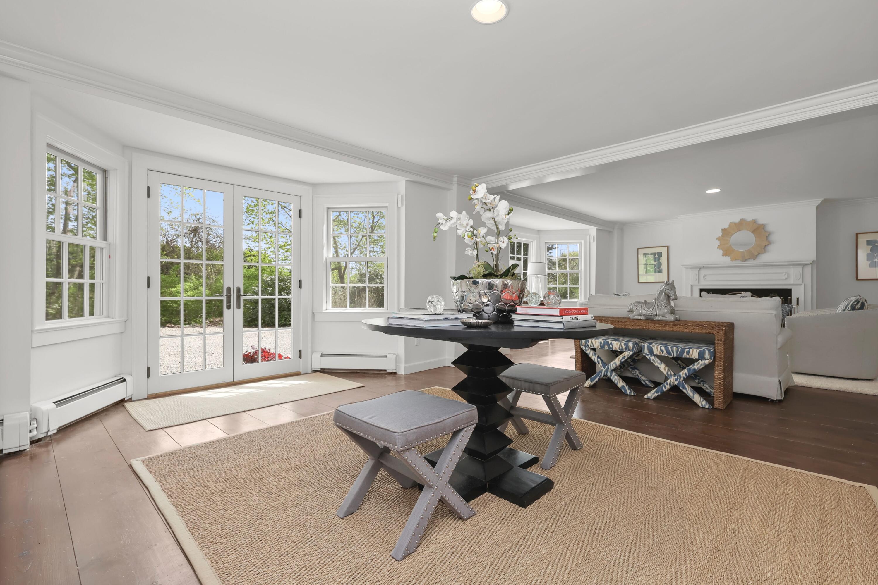 203 Brushy Ridge Road New Canaan, CT 06840 - Photo 8 of 42 a living room with furniture a large window and table