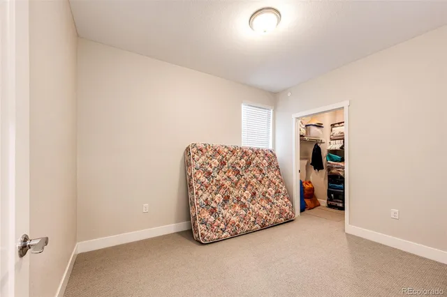 a view of furniture and closet in a room