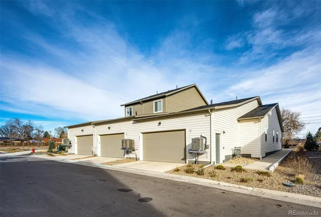 a view of a house with a snow in the background