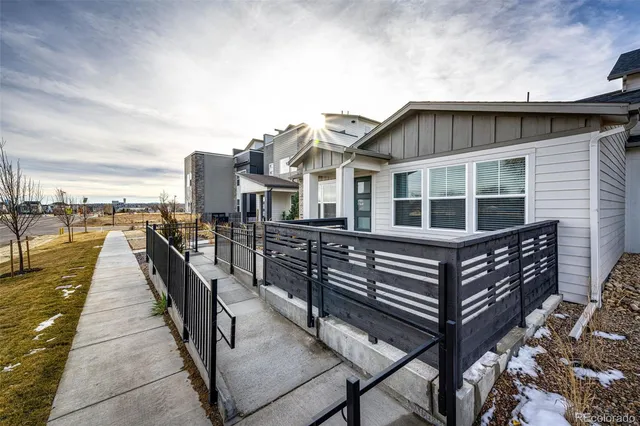a view of a roof deck with wooden floor and stairs