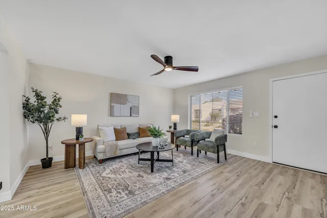 a living room with furniture and a large window