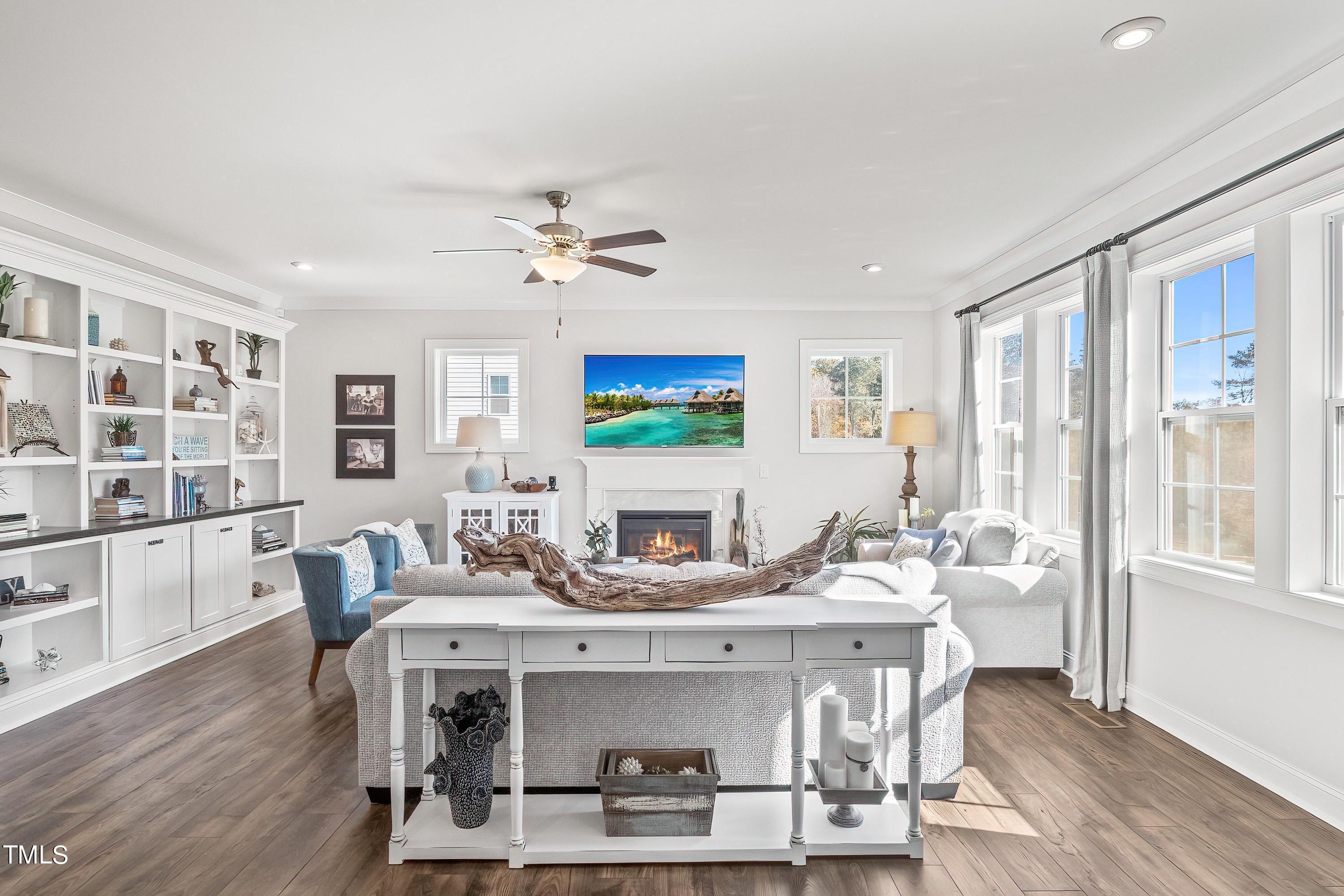 2025 Braeburn Drive Apex, NC 27539 - Photo 11 of 71 a view of a dining room with furniture window and wooden floor