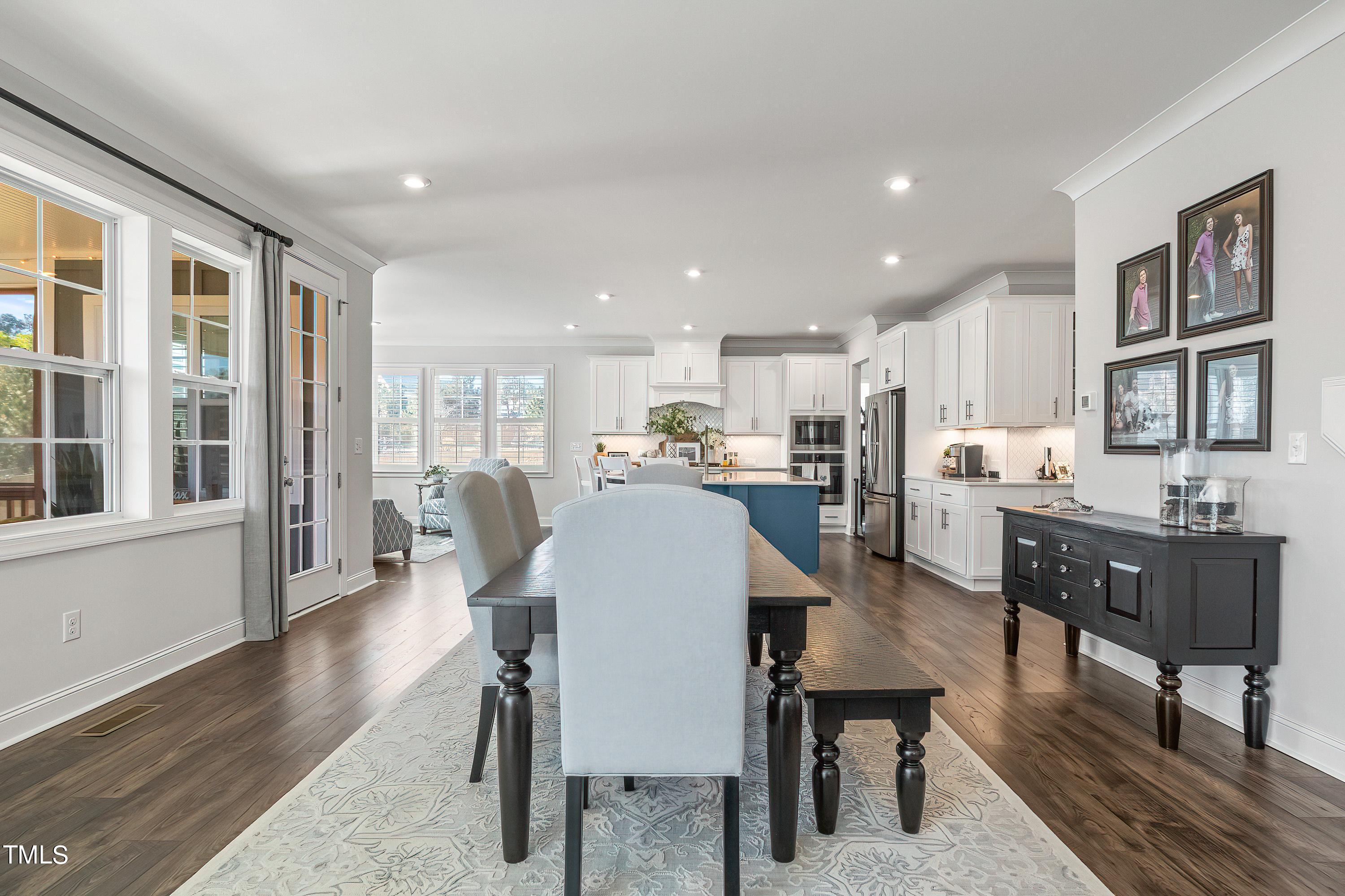 2025 Braeburn Drive Apex, NC 27539 - Photo 12 of 71 a large kitchen with a table and chairs