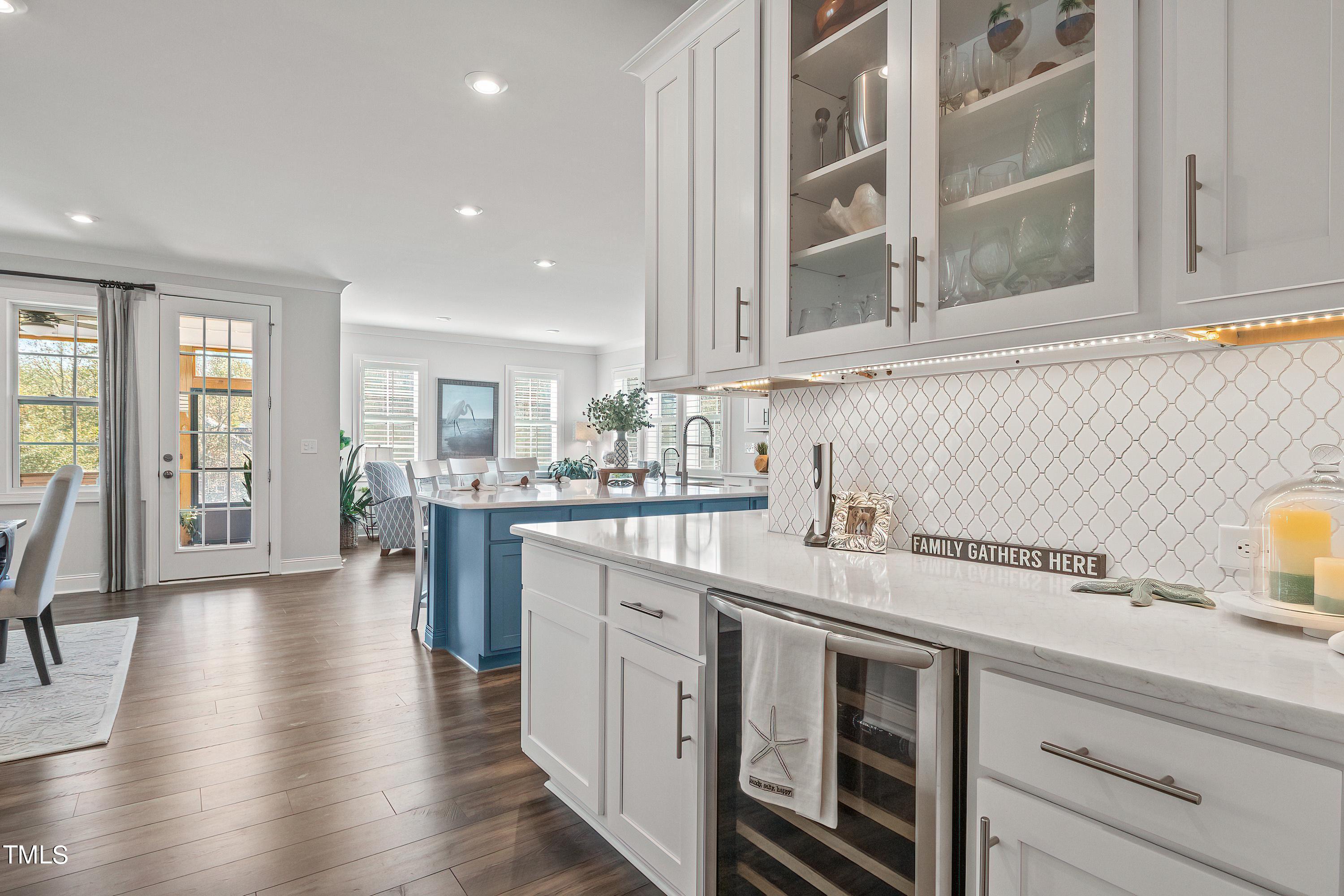 2025 Braeburn Drive Apex, NC 27539 - Photo 21 of 71 a kitchen with a sink stove and cabinets