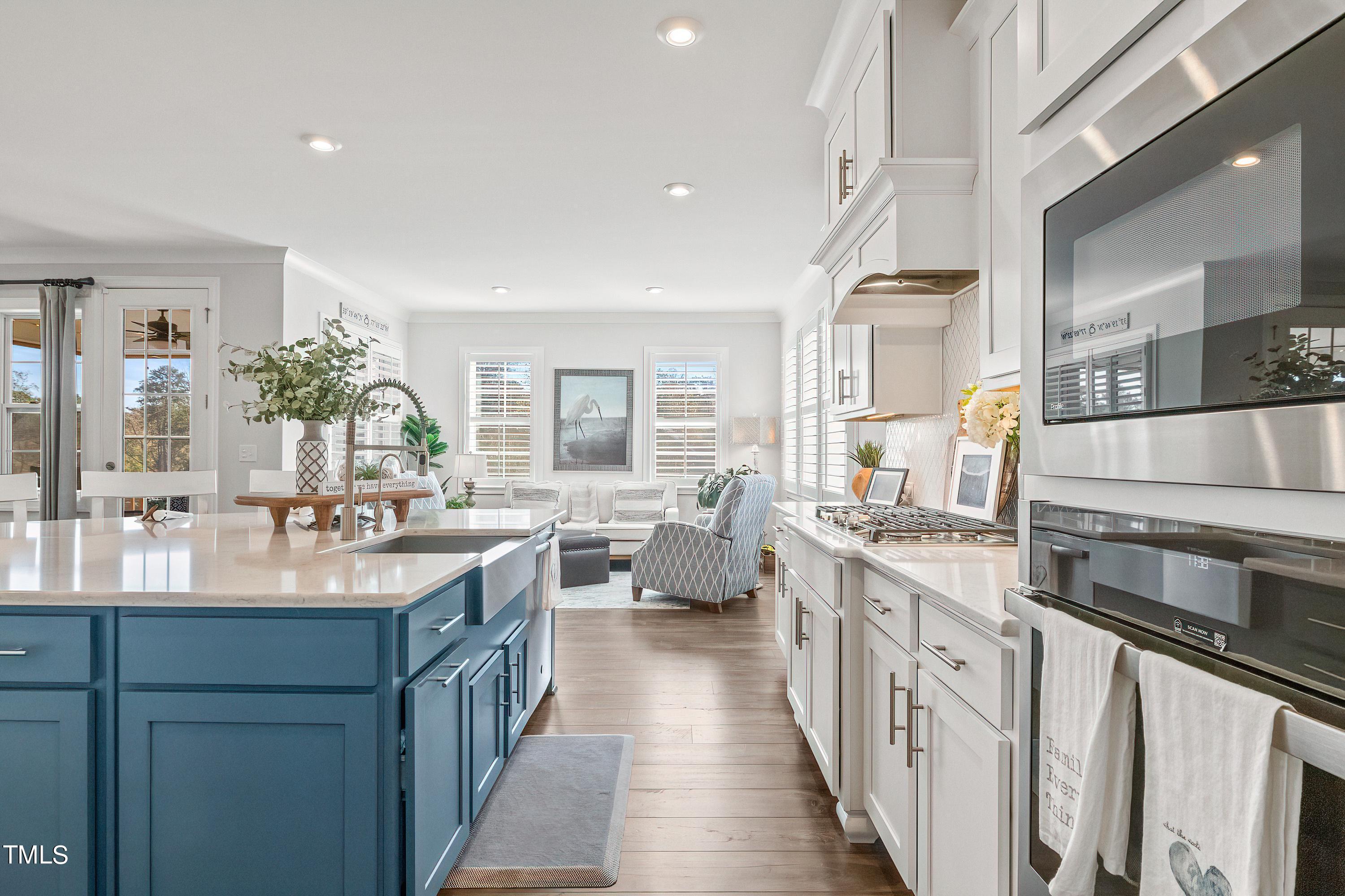 2025 Braeburn Drive Apex, NC 27539 - Photo 23 of 71 a kitchen with counter top space sink stove and refrigerator