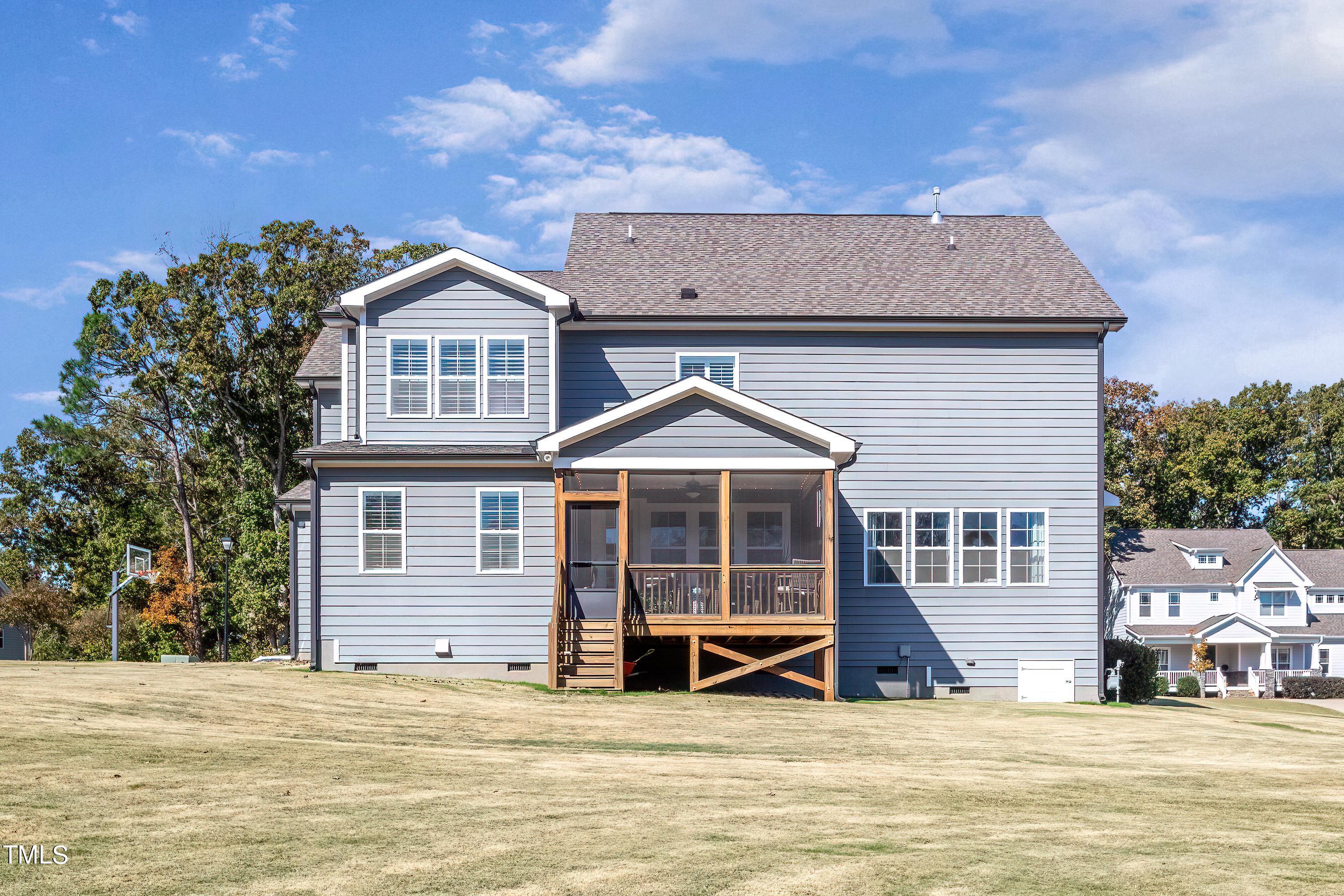 2025 Braeburn Drive Apex, NC 27539 - Photo 55 of 71 a front view of a house with a yard