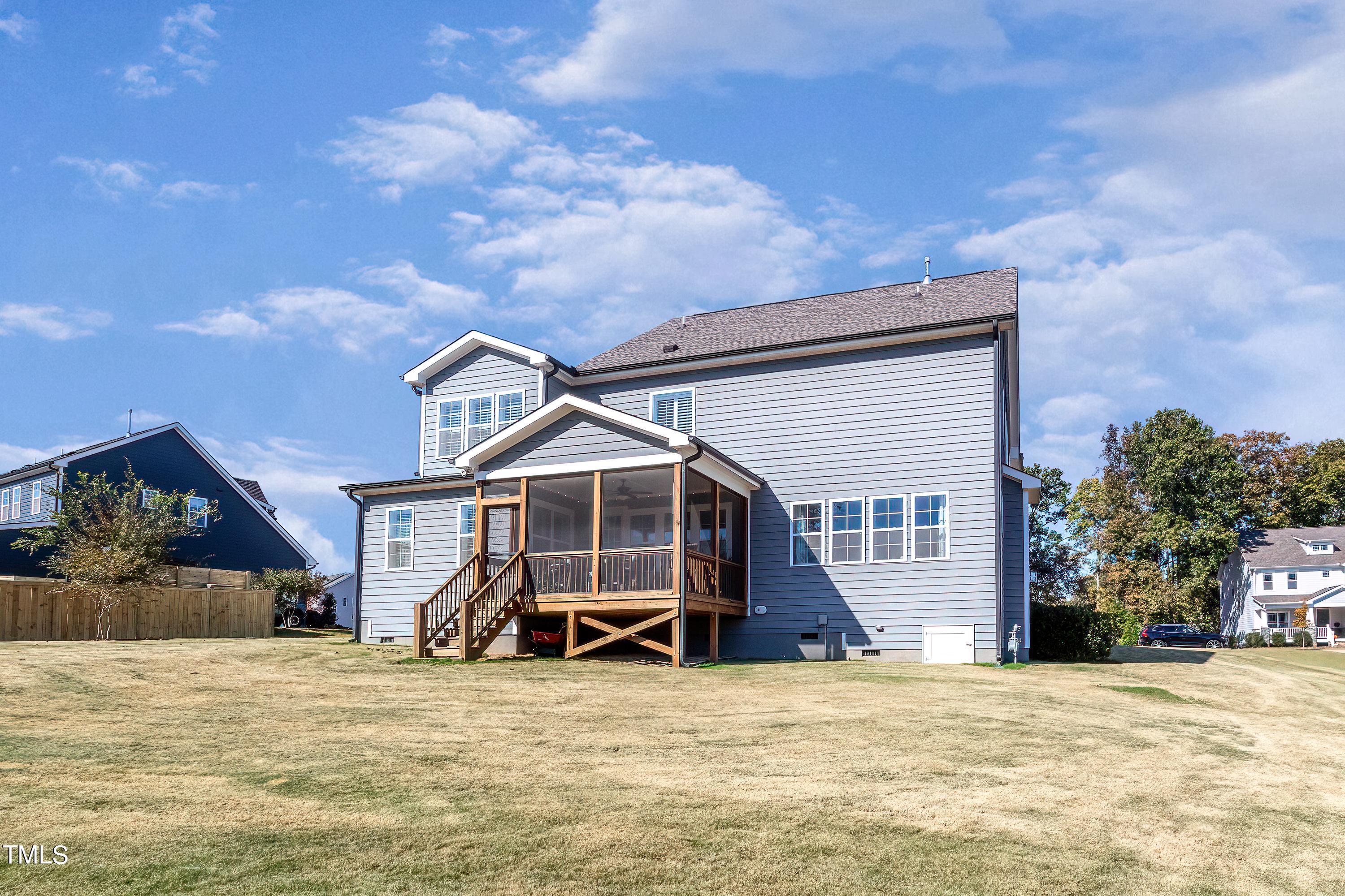 2025 Braeburn Drive Apex, NC 27539 - Photo 56 of 71 a front view of a house with a yard