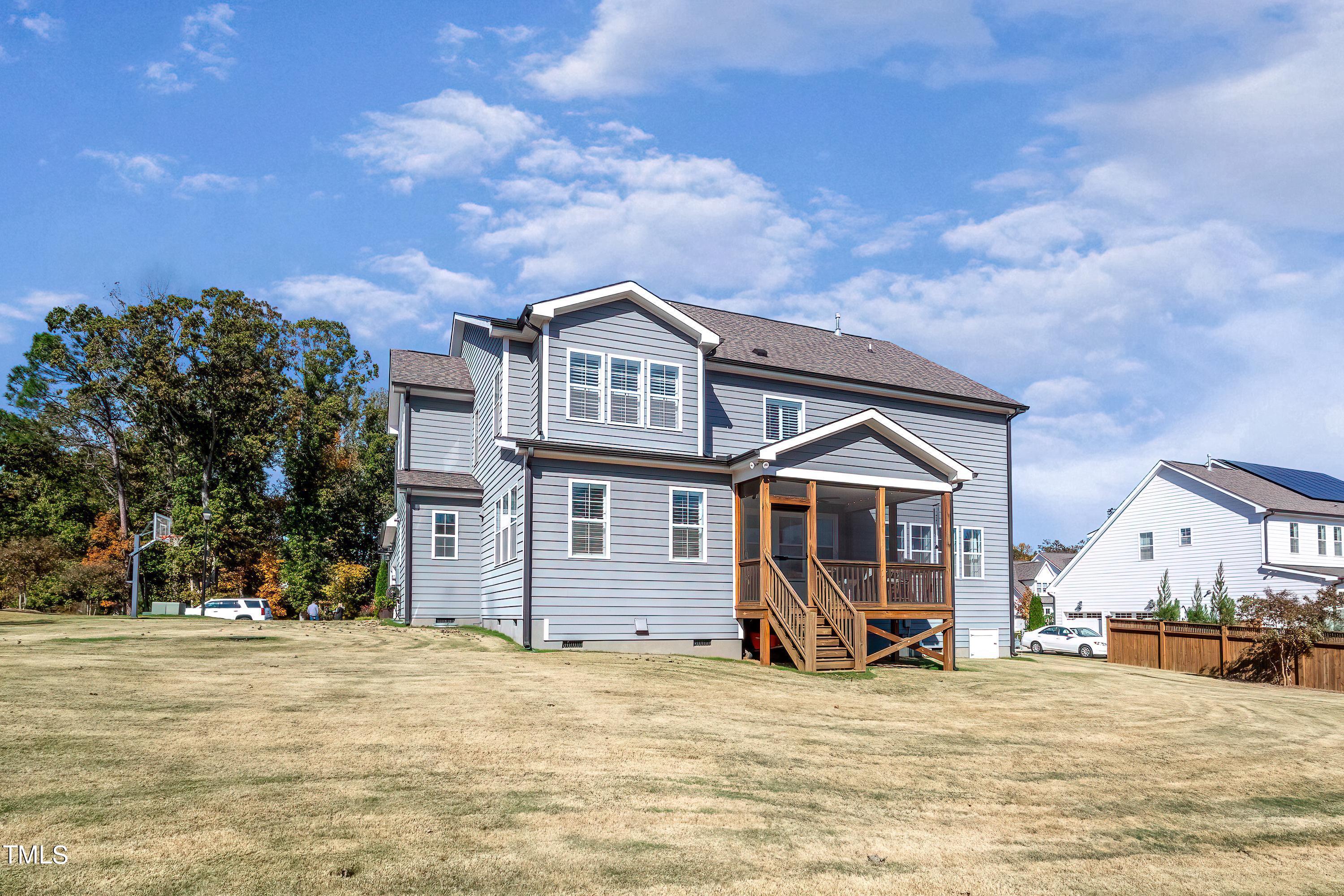 2025 Braeburn Drive Apex, NC 27539 - Photo 58 of 71 a view of a house with a patio