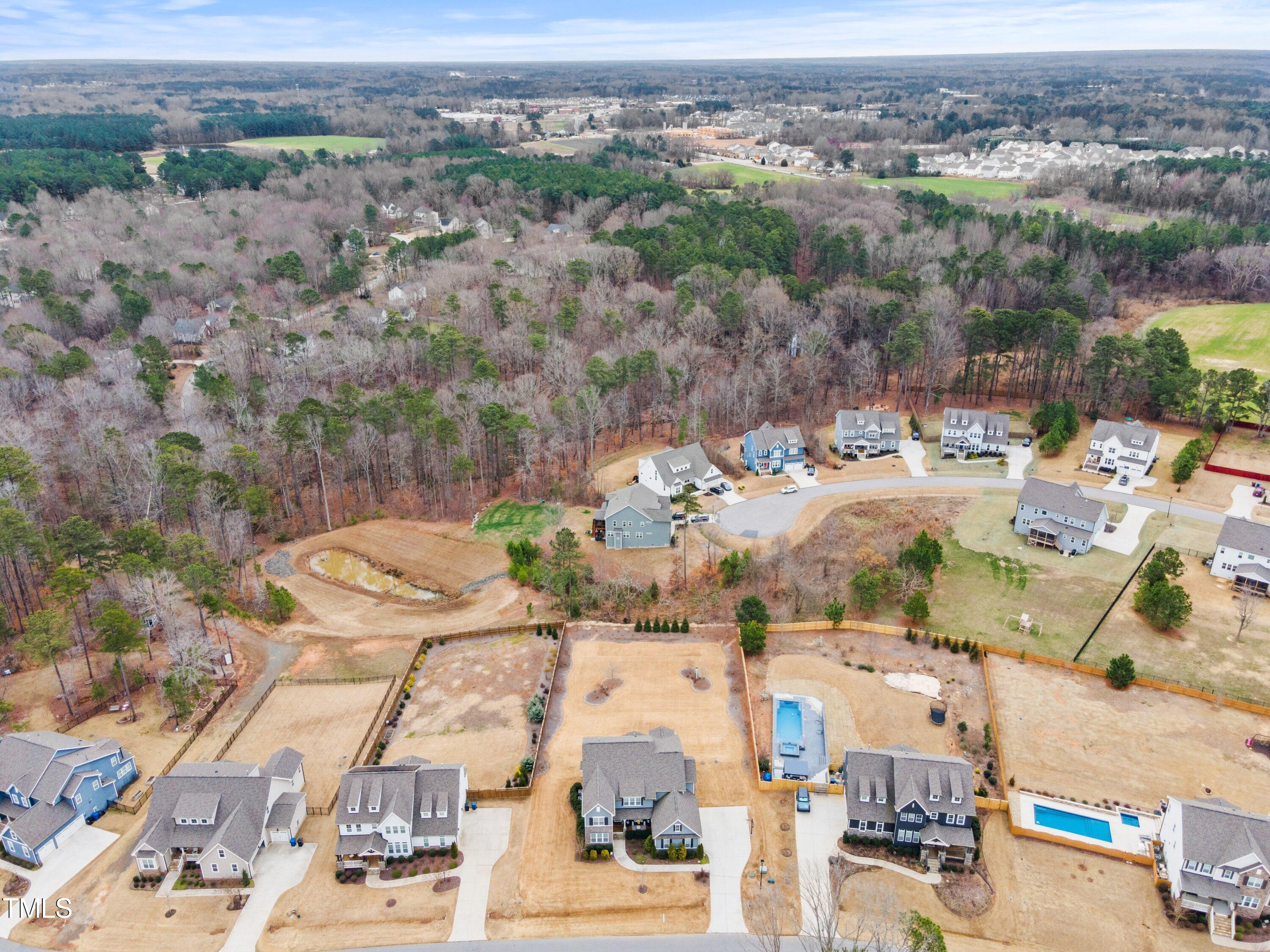 2025 Braeburn Drive Apex, NC 27539 - Photo 66 of 71 an aerial view of residential houses with outdoor space