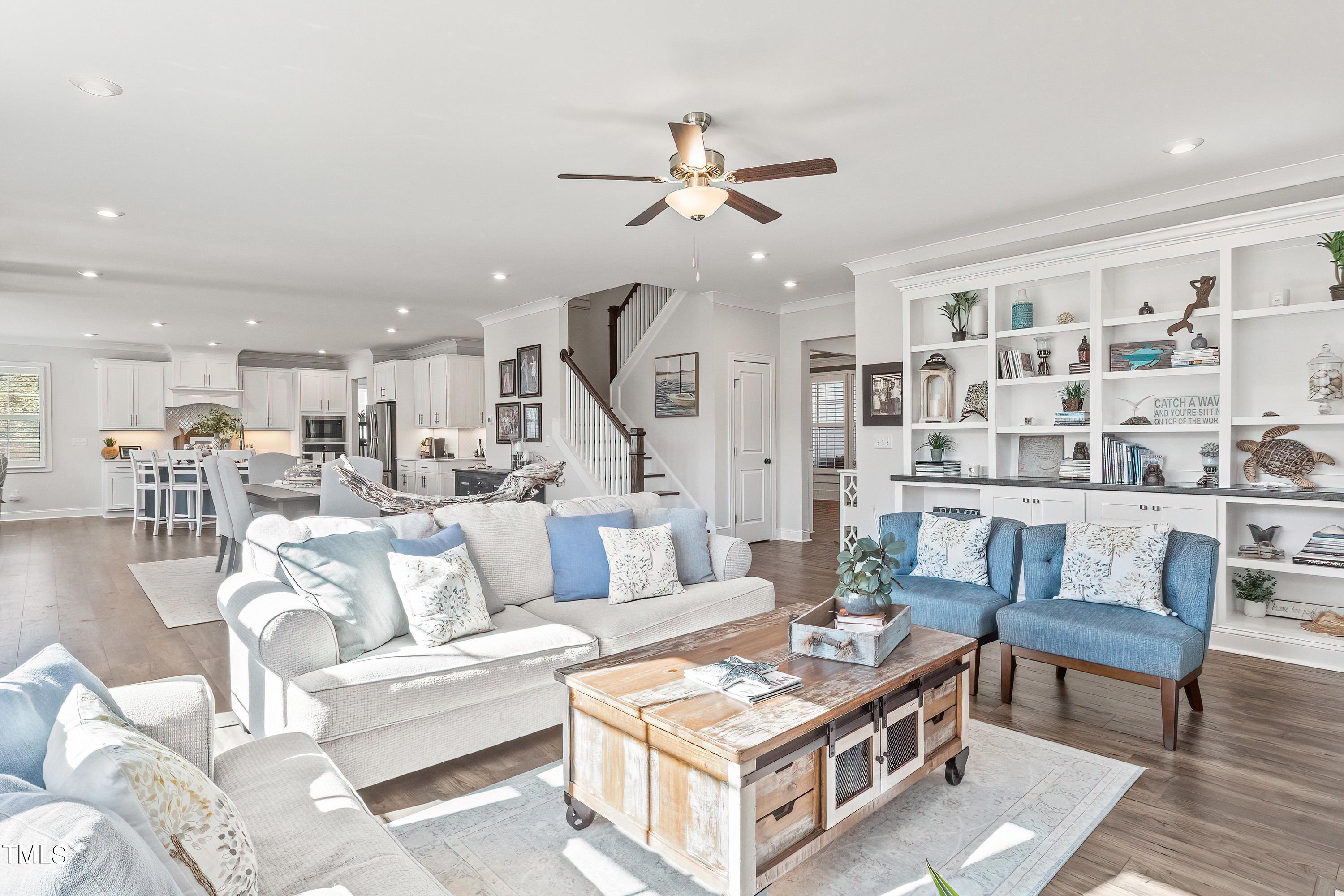 2025 Braeburn Drive Apex, NC 27539 - Photo 8 of 71 a living room with furniture and a table