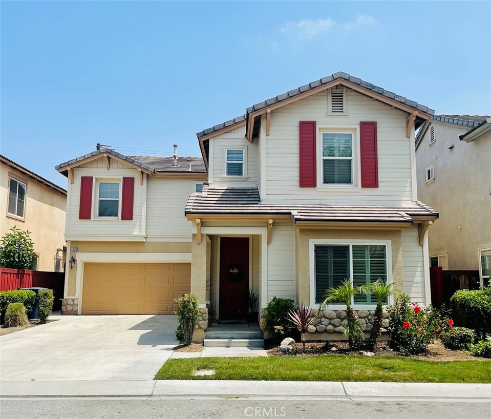 4135 Garvey Way Riverside, CA 92501 - Photo 1 of 1 a front view of a house with a yard and outdoor seating