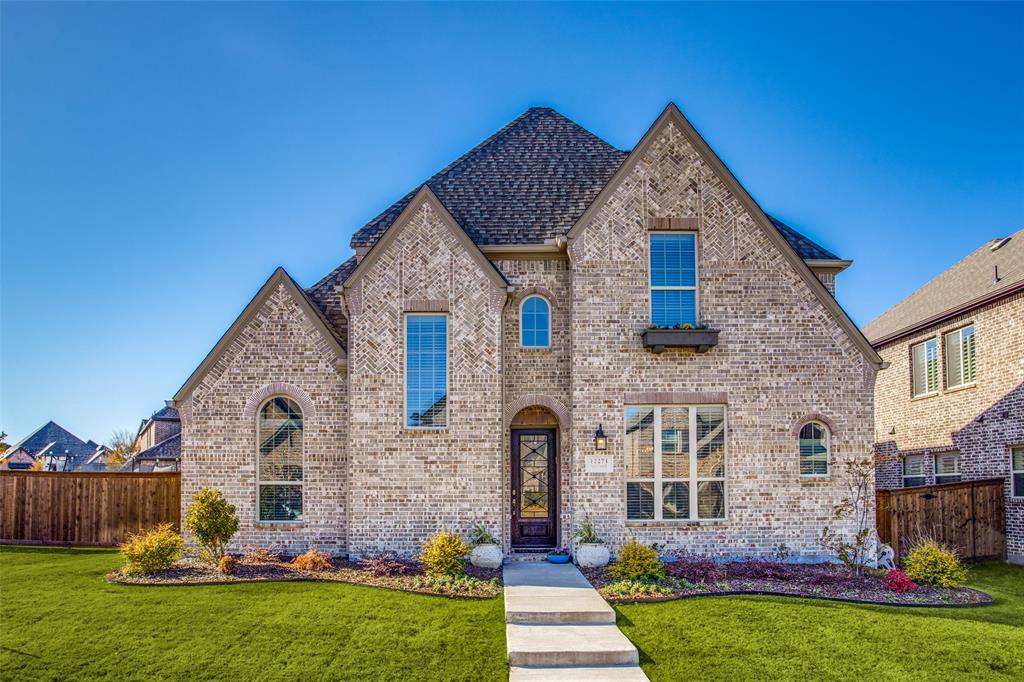 12271 Curry Creek Drive Frisco, TX 75035 - Photo 1 of 1 a front view of a house with garden