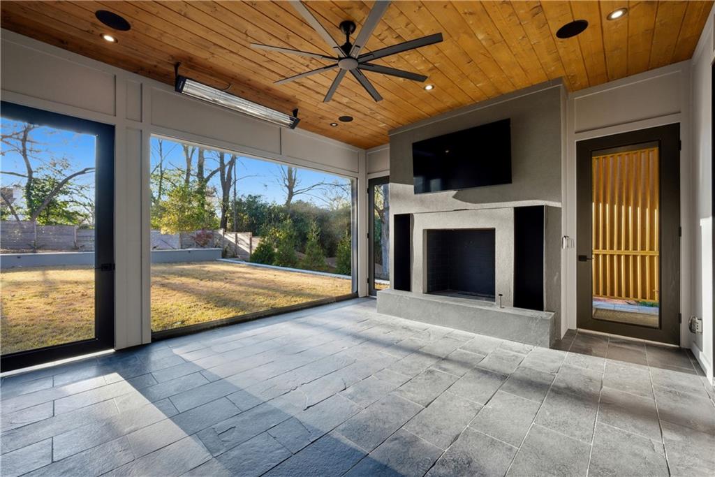 1033 Reeder Circle Northeast Atlanta, GA 30306 - Photo 26 of 52 a view of a patio with a fireplace and a fireplace