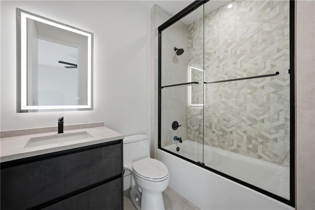 1033 Reeder Circle Northeast Atlanta, GA 30306 - Photo 33 of 52 a bathroom with a sink toilet and shower