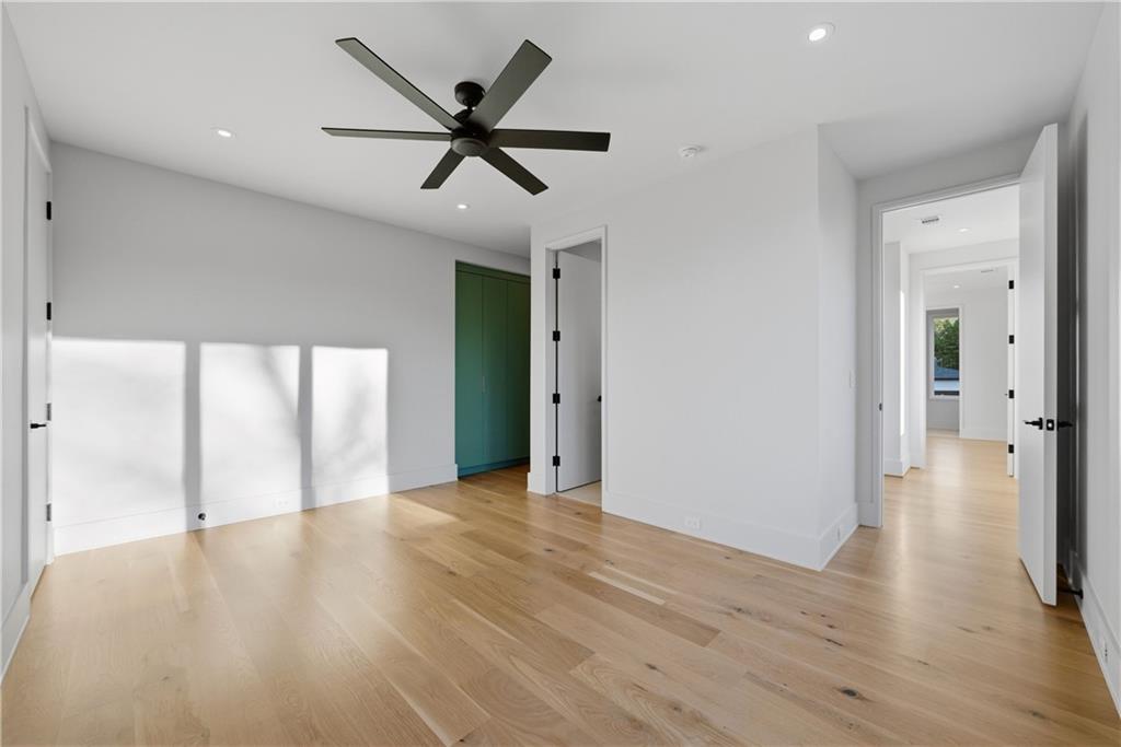 1033 Reeder Circle Northeast Atlanta, GA 30306 - Photo 34 of 52 a view of an empty room with wooden floor and a window