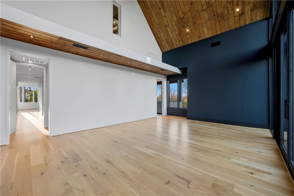 1033 Reeder Circle Northeast Atlanta, GA 30306 - Photo 40 of 52 a view of an empty room with wooden floor and a window