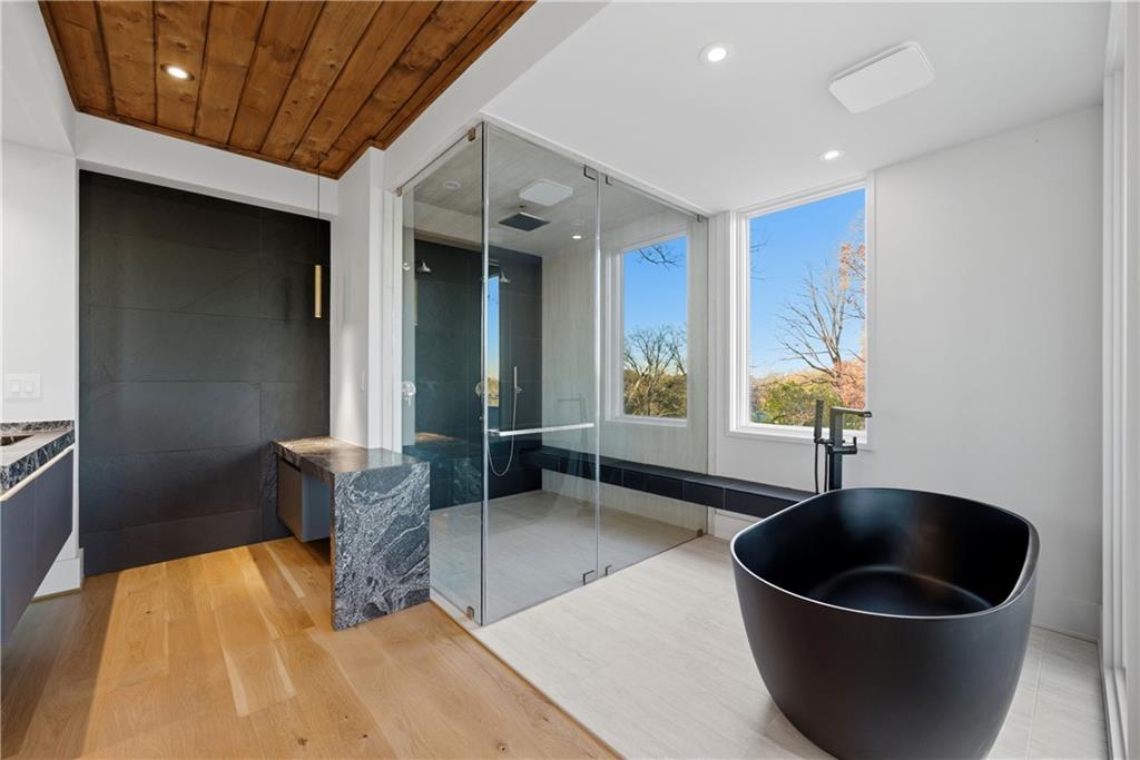 1033 Reeder Circle Northeast Atlanta, GA 30306 - Photo 43 of 52 a living room with a couch and a potted plant
