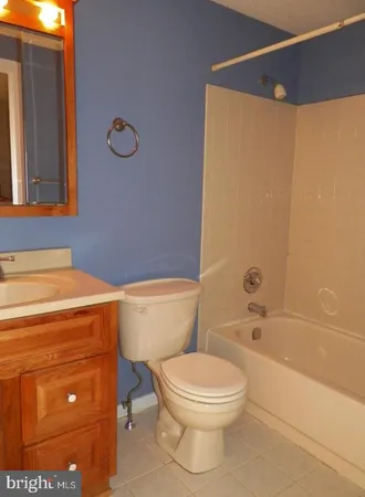 a bathroom with a toilet a sink and bathtub