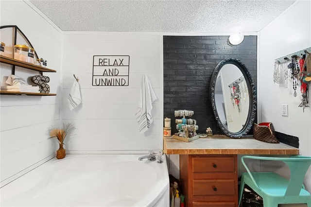 a view of balcony with wooden floor and fence