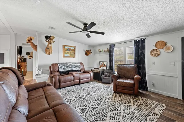 a very nice looking room with a dining table chairs with wooden floor