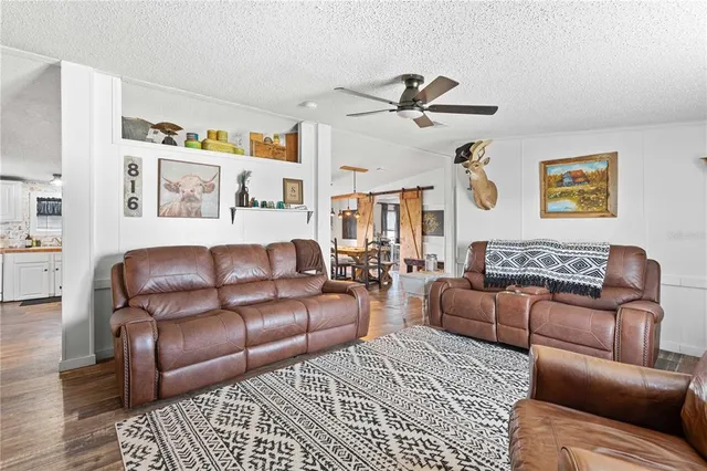 a kitchen with a sink a stove and cabinets