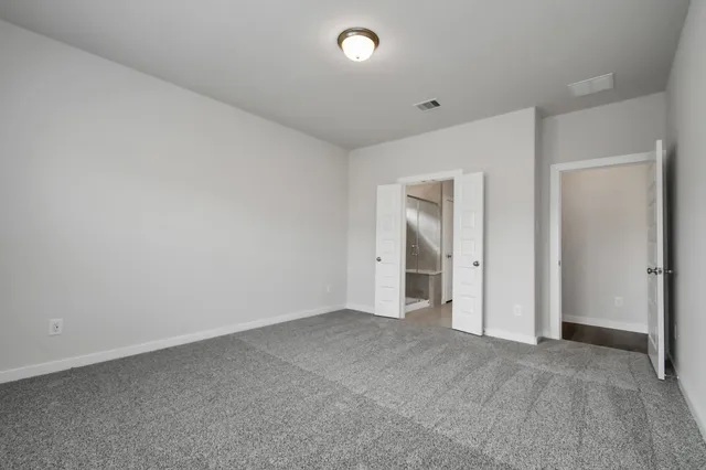 a bathroom with a double vanity sink and mirror