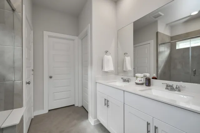 a bathroom with a sink and mirror