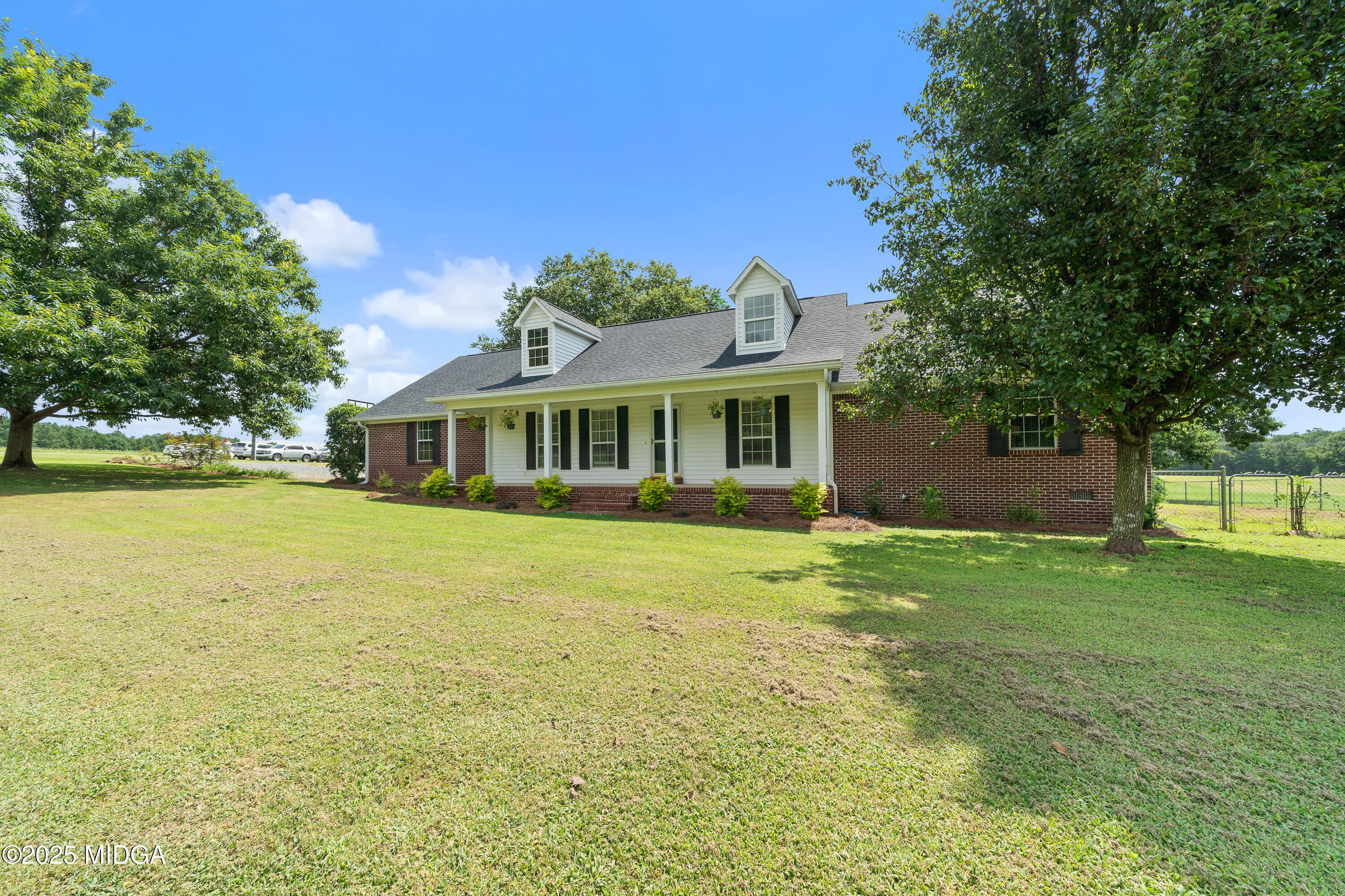 299 Colvin Road Forsyth, GA 31029 - Photo 1 of 51 a front view of a house with a garden