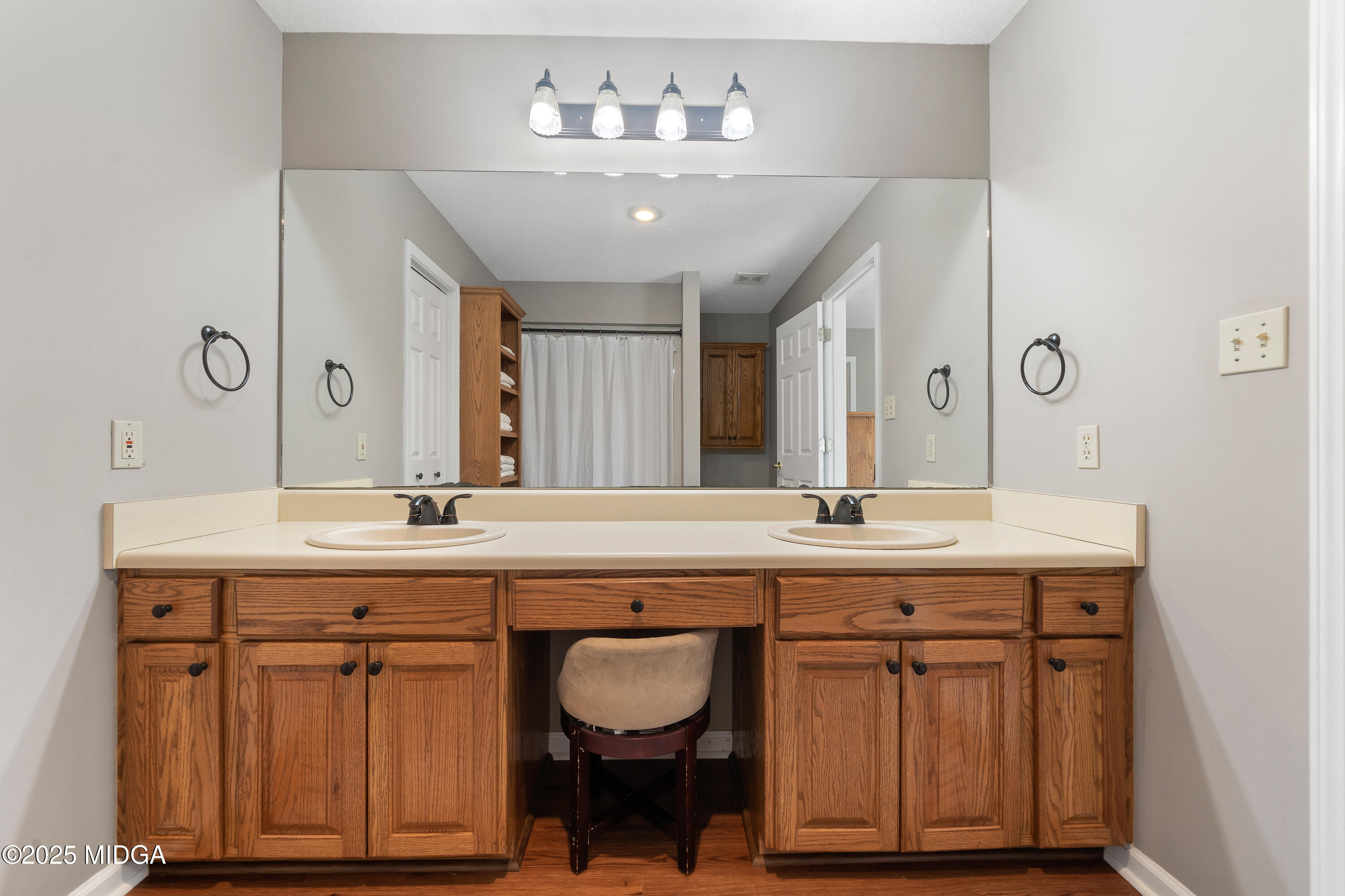 299 Colvin Road Forsyth, GA 31029 - Photo 20 of 51 a bathroom with double vanity and a mirror