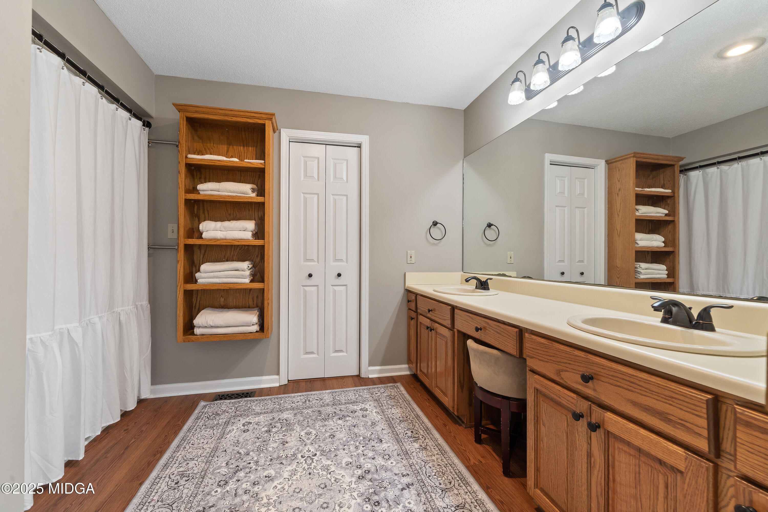 299 Colvin Road Forsyth, GA 31029 - Photo 21 of 51 a spacious bathroom with a double vanity sink and a mirror