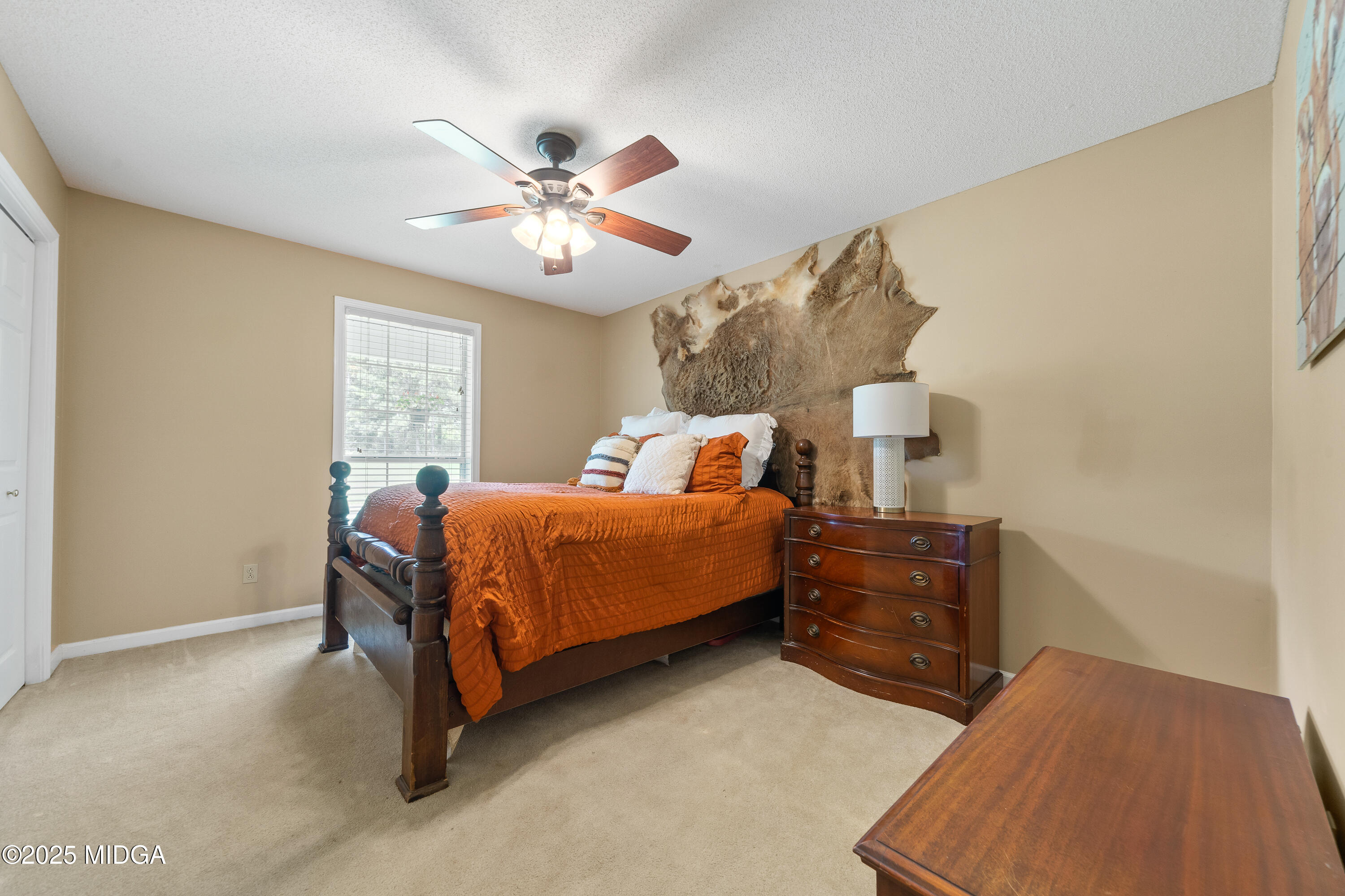 299 Colvin Road Forsyth, GA 31029 - Photo 22 of 51 a bedroom with a bed and window