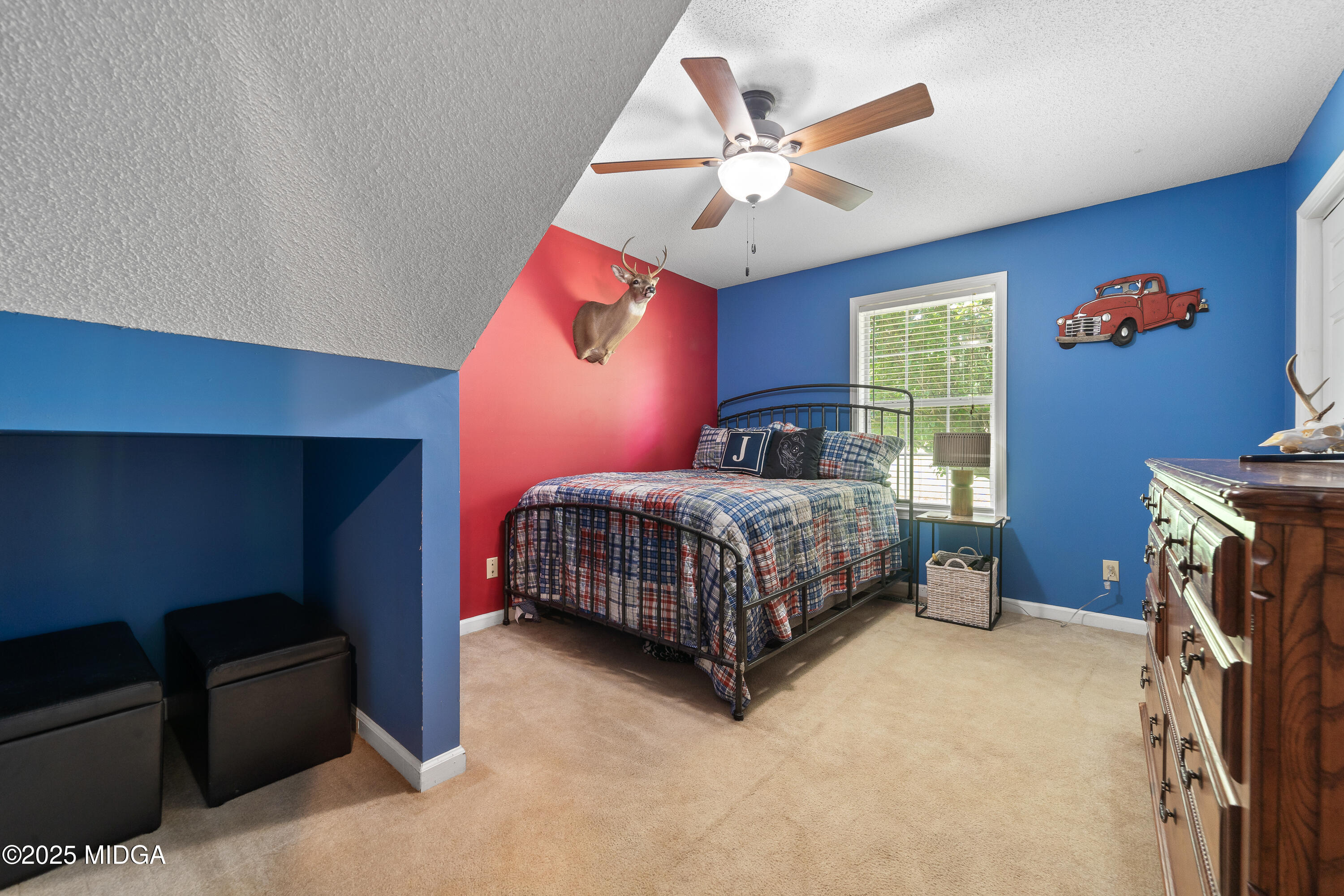 299 Colvin Road Forsyth, GA 31029 - Photo 25 of 51 a bedroom with a bed and a chandelier