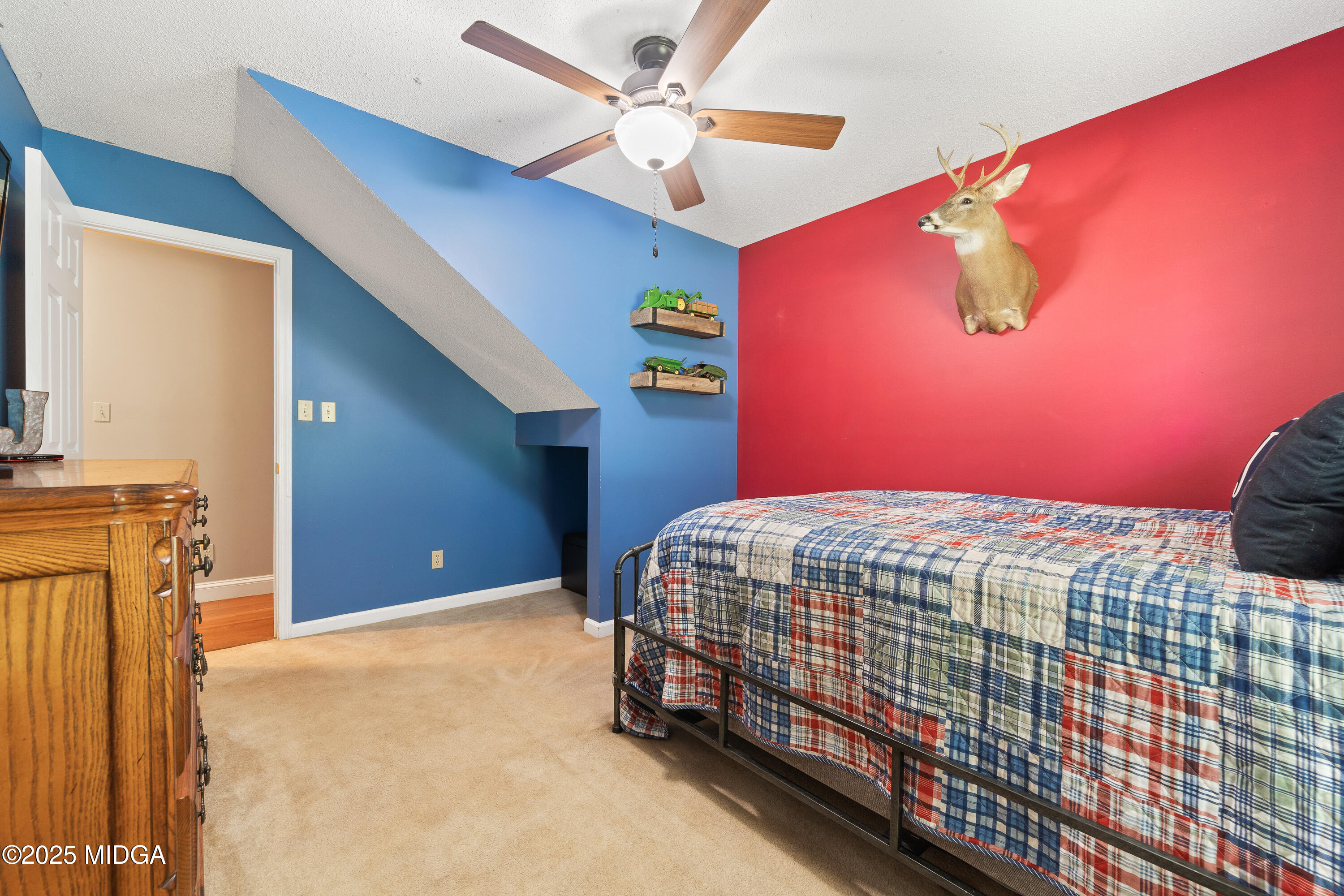 299 Colvin Road Forsyth, GA 31029 - Photo 26 of 51 a bedroom with a bed and a chandelier